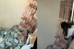 Chỗ giấu tiền bá đạo nhất thế giới: Những cột tiền chất cao như núi sau bức tường kín