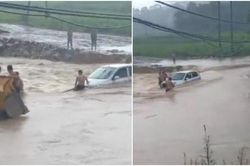 Giải cứu bất thành ô tô bị chết máy khi cố vượt cơn lũ dữ