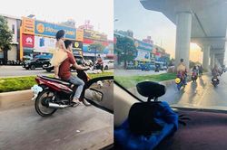 Kinh hãi bố để con gái đứng sau yên xe phóng vun vút