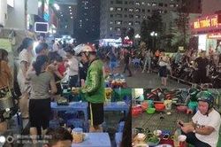 Bát cùng một số đồ vật rơi từ tầng 26 chung cư Linh Đàm xuống đất, hàng chục thực khách vội vã tháo chạy