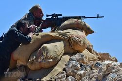 Các chiến binh người Kurd bắt đầu rời miền Bắc Syria