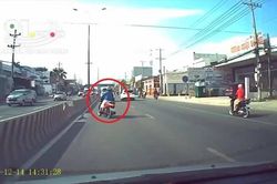 Thót tim với cô gái đi xe máy ngủ gật đánh võng như người say
