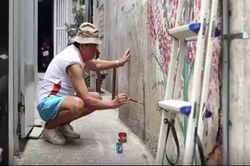 Người nghệ sĩ vẽ mùa xuân trong hẻm Sài Gòn