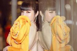 Giữa tin đồn chồng ngoại tình, Elly Trần tái xuất lung linh ví mình là 'hoa hồng vàng trong mùa bão'