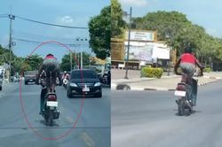 Người đàn ông 'diễn xiếc' trên xe máy chạy giữa đường