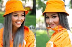 H'Hen Niê biến hóa như 'tắc kè hoa' với tóc bạch kim và cả 'cây' màu cam rực rỡ