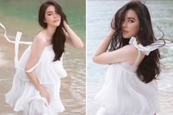 Lý Nhã Kỳ diện váy trắng mỏng manh khoe dáng quyến rũ trước biển