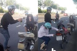 Thấy 2 mẹ con loay hoay dắt xe máy giữa trưa nắng, nam thanh niên có hành động khiến nhiều người ấm lòng