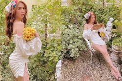 Ngọc Trinh tựa thiên thần quyến rũ trong vườn hoa lá với set đồ trắng gợi cảm