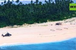 Hy hữu 3 người đàn ông thoát chết nhờ viết SOS trên bãi cát