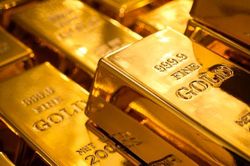 Giá vàng hạ nhiệt khi kinh tế Mỹ và đồng USD gượng dậy