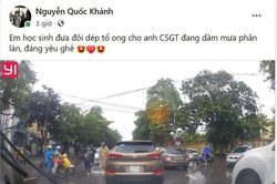 Ấm lòng học sinh tặng dép tổ ong cho chiến sỹ CSGT chân trần đứng phân làn giao thông giữa trời mưa