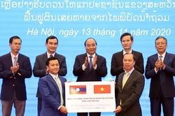 Việt Nam hỗ trợ 1.000 tấn gạo giúp Lào khắc phục hậu quả thiên tai