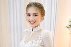 Streamer Xemesis và Trang Phạm mặc áo dài cưới 50 triệu đồng