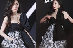 Dương Mịch diện váy nơ khủng hở vòng 1 'căng tràn' đầy sức sống liên tục lấy tay che trên thảm đỏ
