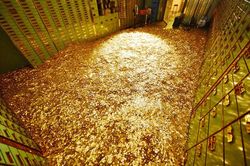 Giá vàng hôm nay 27/12: Vàng gặp lực cản, USD nhích tăng