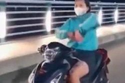 Quảng Ngãi: 'Cô gái đầu trần phóng xe, múa quạt' bị phạt 7,4 triệu đồng