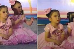 Cô bé đang múa thì ngồi phịch xuống sân khấu để ngủ, bạn đánh thức thế nào cũng không dậy