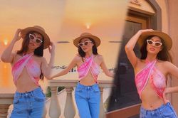 Hoa hậu Lương Thùy Linh đu trend lấy khăn quấn thành áo yếm xẻ ngực táo bạo