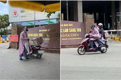 Giữa thời tiết 40 độ, người chồng mặc áo mưa dày cộm đến bệnh viện đón vợ, lí do đằng sau gây bất ngờ