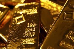 Vàng tụt giá mạnh do đồng USD tăng trở lại