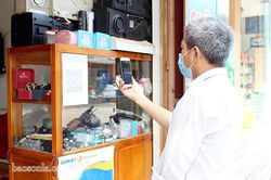 Thực hiện việc quét QR Code phòng chống dịch COVID -19