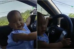 Liều lĩnh để con nhỏ cầm vô lăng lái ô tô trên đường, ông bố còn thản nhiên cầm điện thoại quay clip