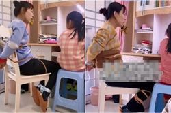Dạy con học bài, bà mẹ phải trói tay buộc chân mình vào ghế để tránh mất bình tĩnh