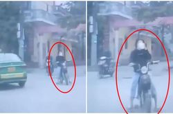 Cô gái đầu trần đi xe đạp điện 'ôm cua vèo vèo', ngửa cổ uống trà sữa rồi đâm vào ô tô