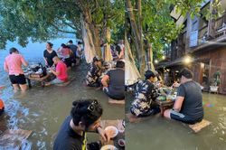Khách chịu ướt nửa người, vô tư ăn lẩu giữa nước lũ ngập qua ghế gây kinh ngạc