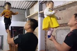 Bố nâng con gái 9 tháng tuổi bằng 1 tay, bị nhắc nhở liền có phản pháo gây bức xúc