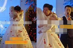 Chú rể ôm ghì chặt cô dâu trên sân khấu mãi không rời, người dẫn chương trình phải 'ra tay' xử lý