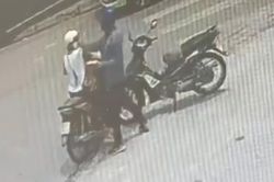 Người phụ nữ bị đánh khi chở con nhỏ