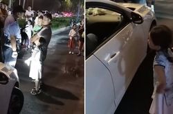Thấy mẹ suýt bị tông trúng và mắng mỏ, bé gái khăng khăng đòi chủ xe phải xin lỗi