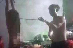 Hé lộ nguyên nhân vụ bé gái bị bố trói 2 tay treo lơ lửng trên trần nhà, cầm roi đánh