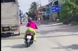 Clip người phụ nữ đánh võng tạt đầu xe tải, buông tay lái