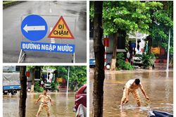 Vĩnh Phúc: CSGT TP Vĩnh Yên phân luồng giao thông tránh những tuyến phố ngập sâu, bảo đảm an toàn