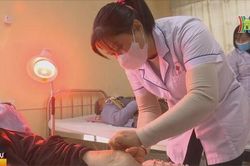 Bệnh viện ngoại thành Hà Nội chống rét cho người bệnh
