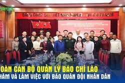 Đoàn cán bộ quản lý báo chí Lào thăm và làm việc với Báo Quân đội nhân dân