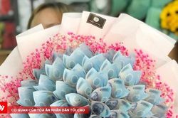 Dùng tiền polymer làm thành bó hoa có vi phạm pháp luật?