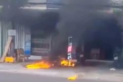 Nam thanh niên tạt xăng tiệm giặt sấy rồi phóng hỏa khiến người cũng cháy như đuốc