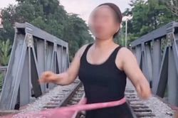 Clip người phụ nữ thản nhiên lắc vòng giữa đường ray tàu hỏa và cái kết