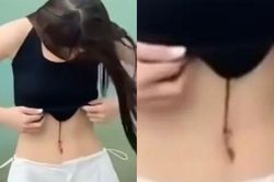 Clip: Khoe eo thon bên hồ, cô gái 'hồn bay phách lạc' vì đỉa bám hút máu trên người