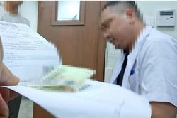 Vụ 'muốn nhanh phải kẹp tiền vào sổ' ở BV E: Nhân viên xạ trị tường trình gì?
