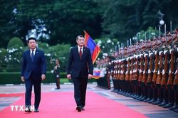 Thủ tướng Lào Saleumxay Kommasith chủ trì lễ đón Thủ tướng Lê Minh Hưng
