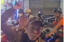 Công an làm việc với người đàn ông cầm gậy đập kính xe tải ở TP.HCM