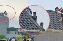 H&agrave;ng chục cảnh s&aacute;t v&acirc;y bắt hai người đ&agrave;n &ocirc;ng cầm kiếm cố thủ tr&ecirc;n n&oacute;c nh&agrave;