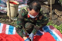 Khai quật và cất bốc 1 hài cốt liệt sĩ tại huyện Nhơn Trạch