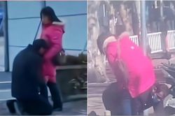 Người đàn ông quỳ gối, chui qua háng vợ giữa phố, thái độ sau đó của chị vợ khiến người đi đường bất bình
