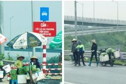 Nguy cơ tai nạn giao thông do quá nhiều người bán hàng rong tại lối vào cao tốc Hà Nội – Hải Phòng